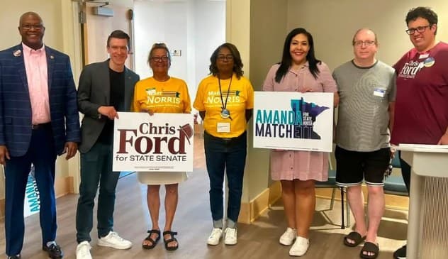 Alex with local candidates and organizers holding Chris Ford for State Senate and Amanda Matchett campaign signs