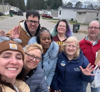 Alex with manufactured-home residents and organizers in their neighborhood